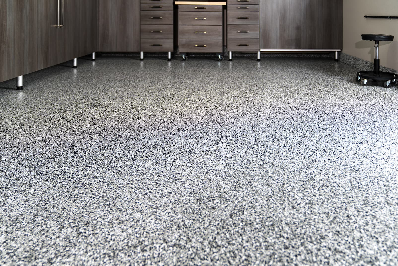 Close-up detail of professionally installed epoxy garage floor coating.