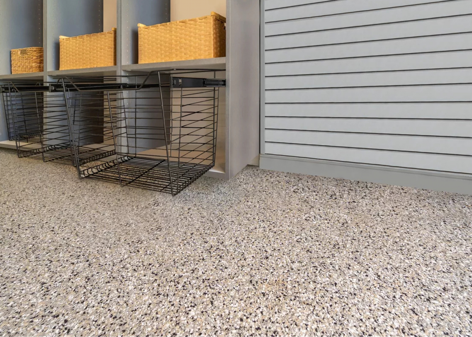 Close-up of a professional garage flooring system with decorative flake coating