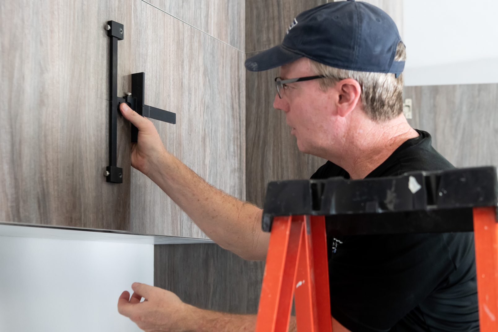 custom garage cabinets installed with wall-mounted storage and workbench