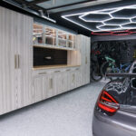 Garage wall storage using cabinet layout designed with storage zones and open floor space