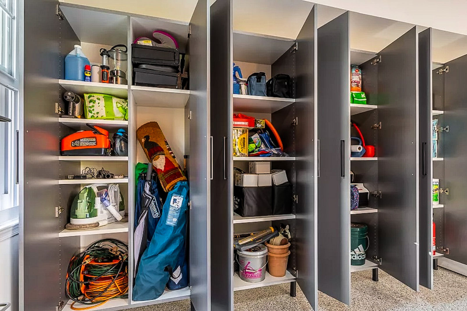 garage cabinet interior showing tall storage compartments and heavy-duty shelf construction