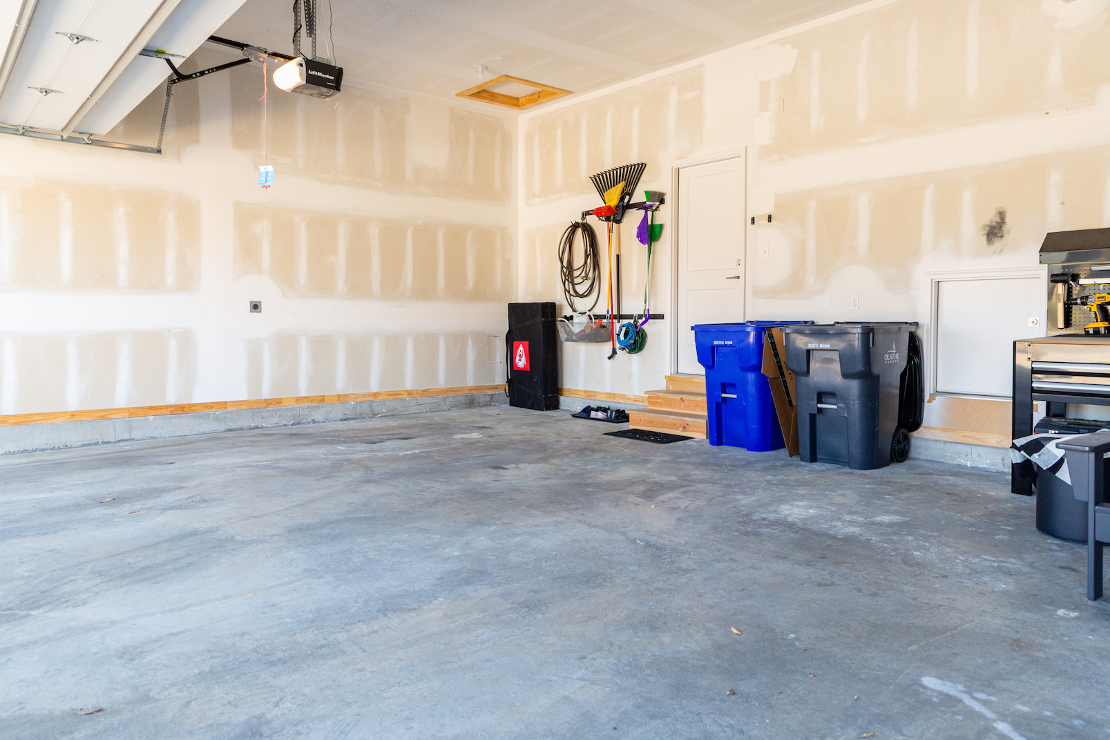 garage cleared and prepared for custom cabinet and flooring installation