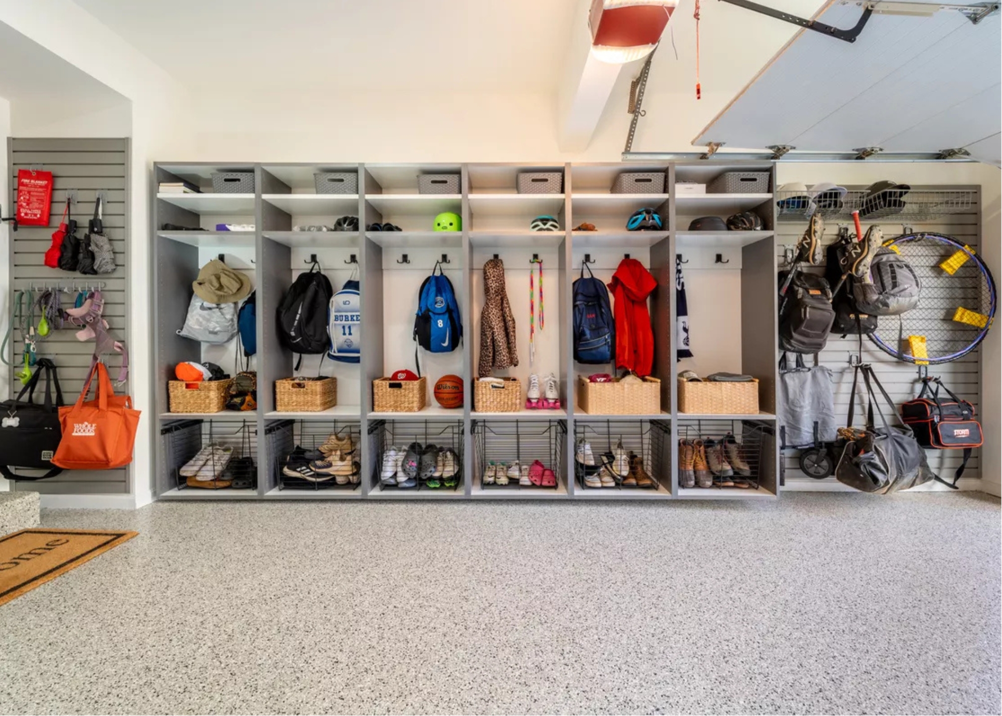 Organized garage cabinets showing separate storage zones for tools and equipment