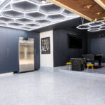 image of a garage wall finish and lighting planned before cabinet installation