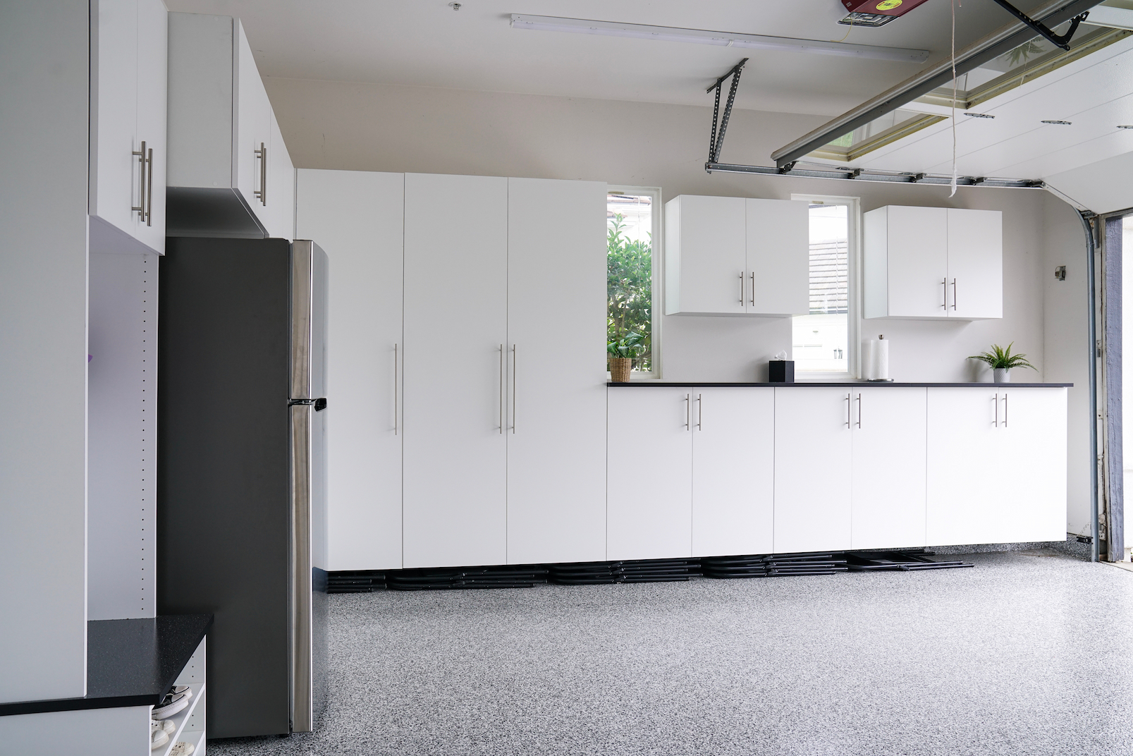 garage cabinets used for concealed storage in finished garage