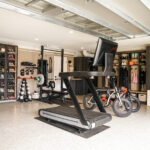 finished garage designed with cabinets flooring and wall storage