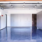 organized garage system with cabinets wall storage and open floor space