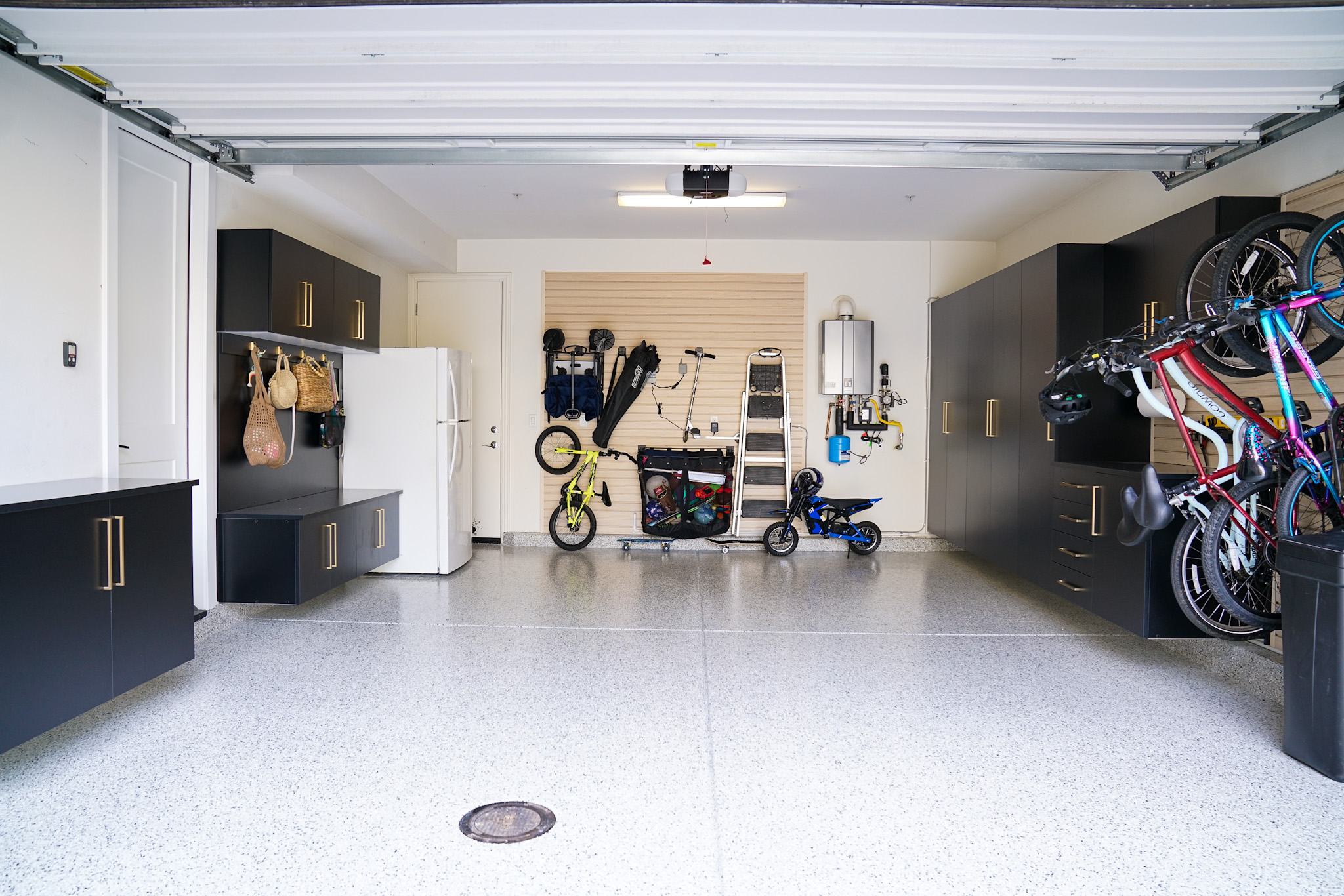garage storage design with cabinets wall storage and open floor space